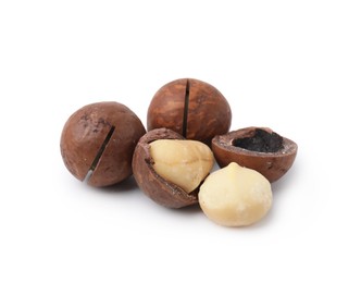 Photo of Macadamia nuts with shells isolated on white