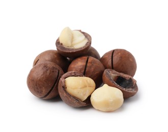 Photo of Macadamia nuts with shells isolated on white