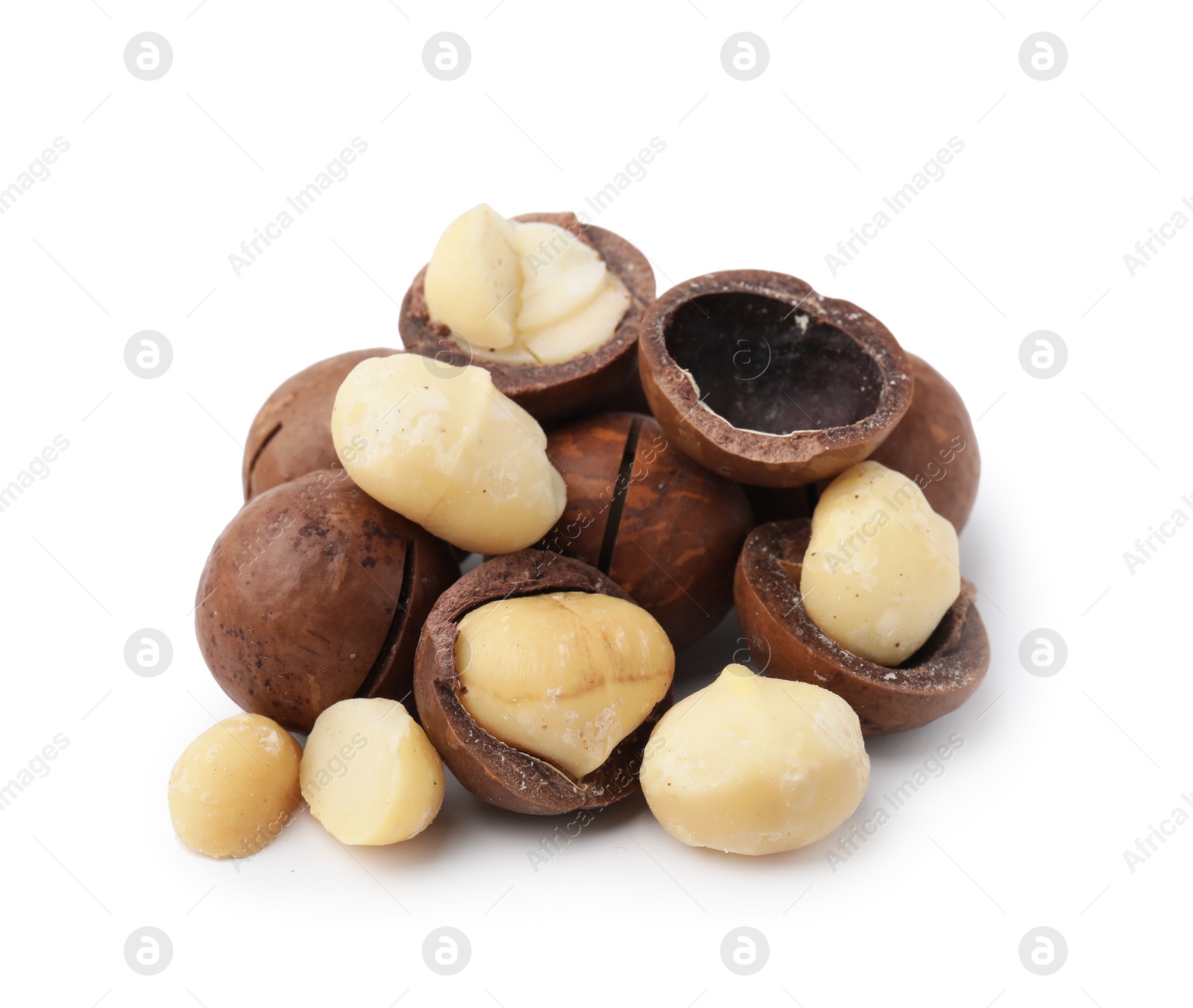 Photo of Macadamia nuts with shells isolated on white