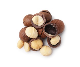 Photo of Macadamia nuts with shells isolated on white, top view