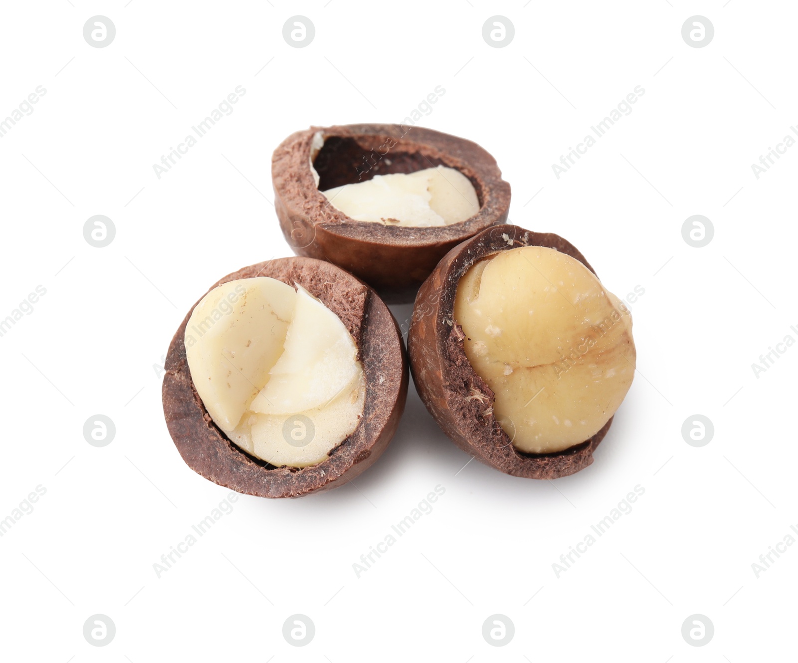 Photo of Macadamia nuts with shells isolated on white