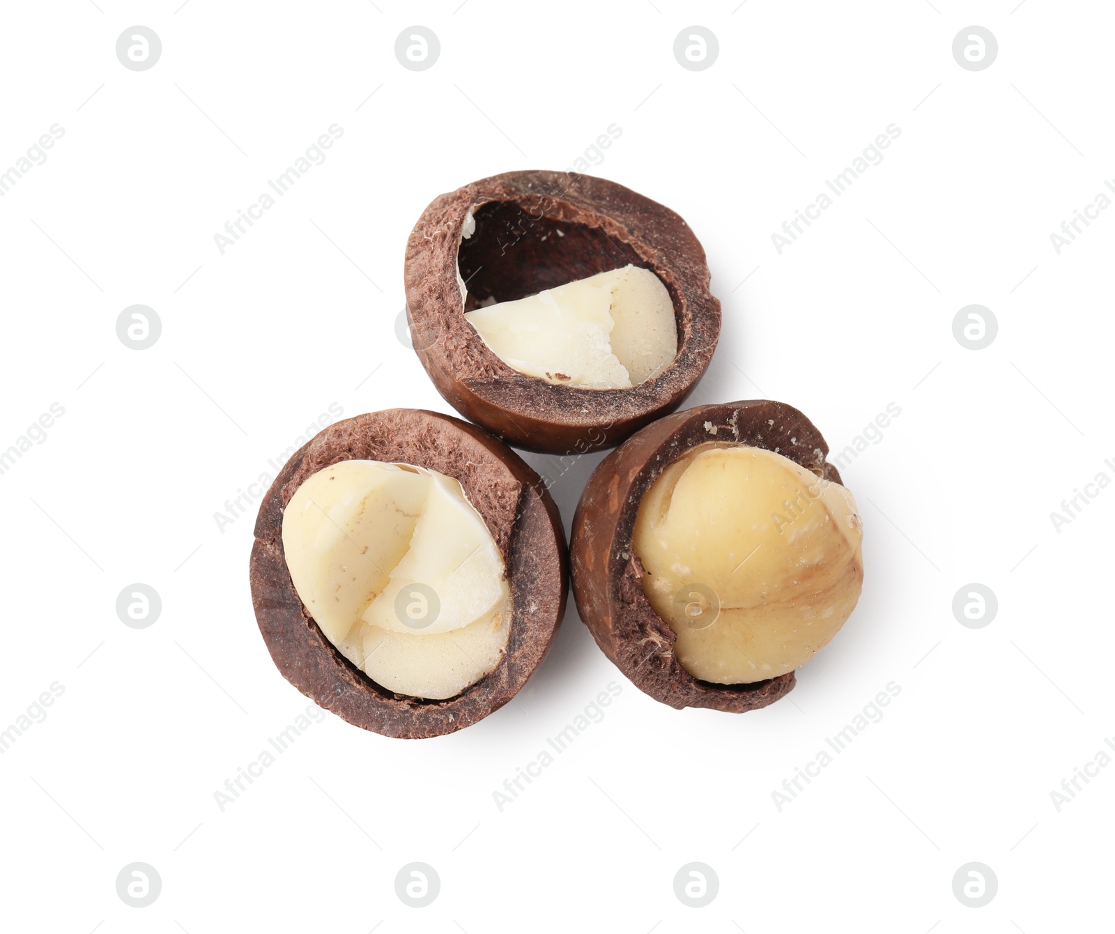 Photo of Macadamia nuts with shells isolated on white, top view