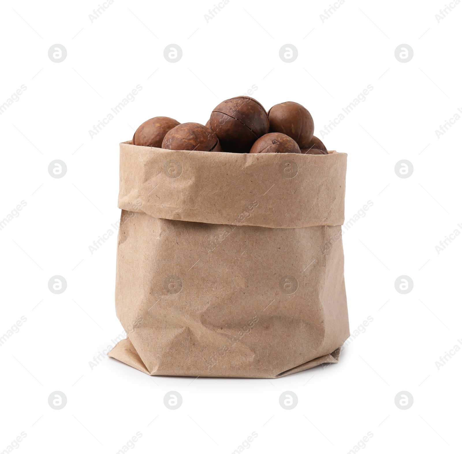 Photo of Macadamia nuts in paper bag isolated on white