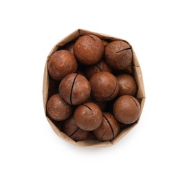 Photo of Macadamia nuts in paper bag isolated on white, top view