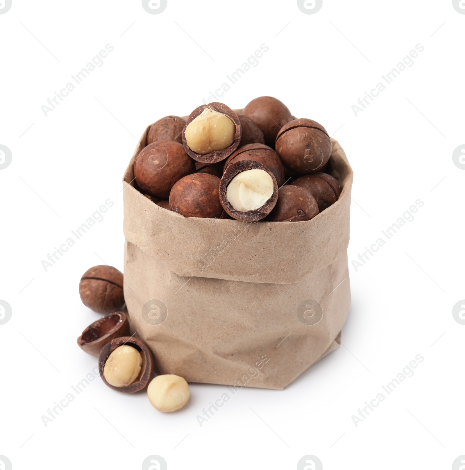 Photo of Macadamia nuts in paper bag isolated on white