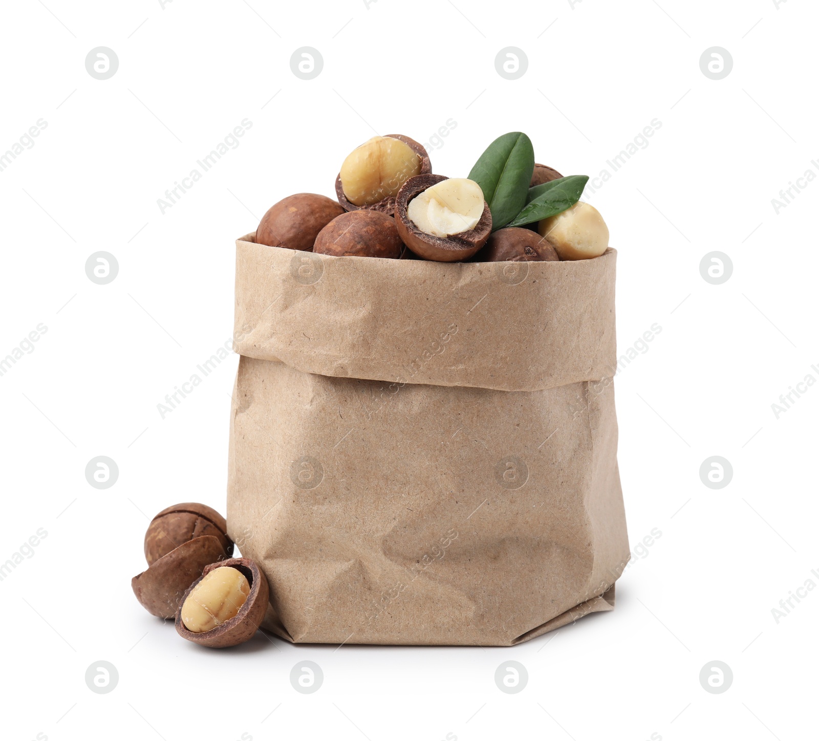 Photo of Macadamia nuts in paper bag isolated on white