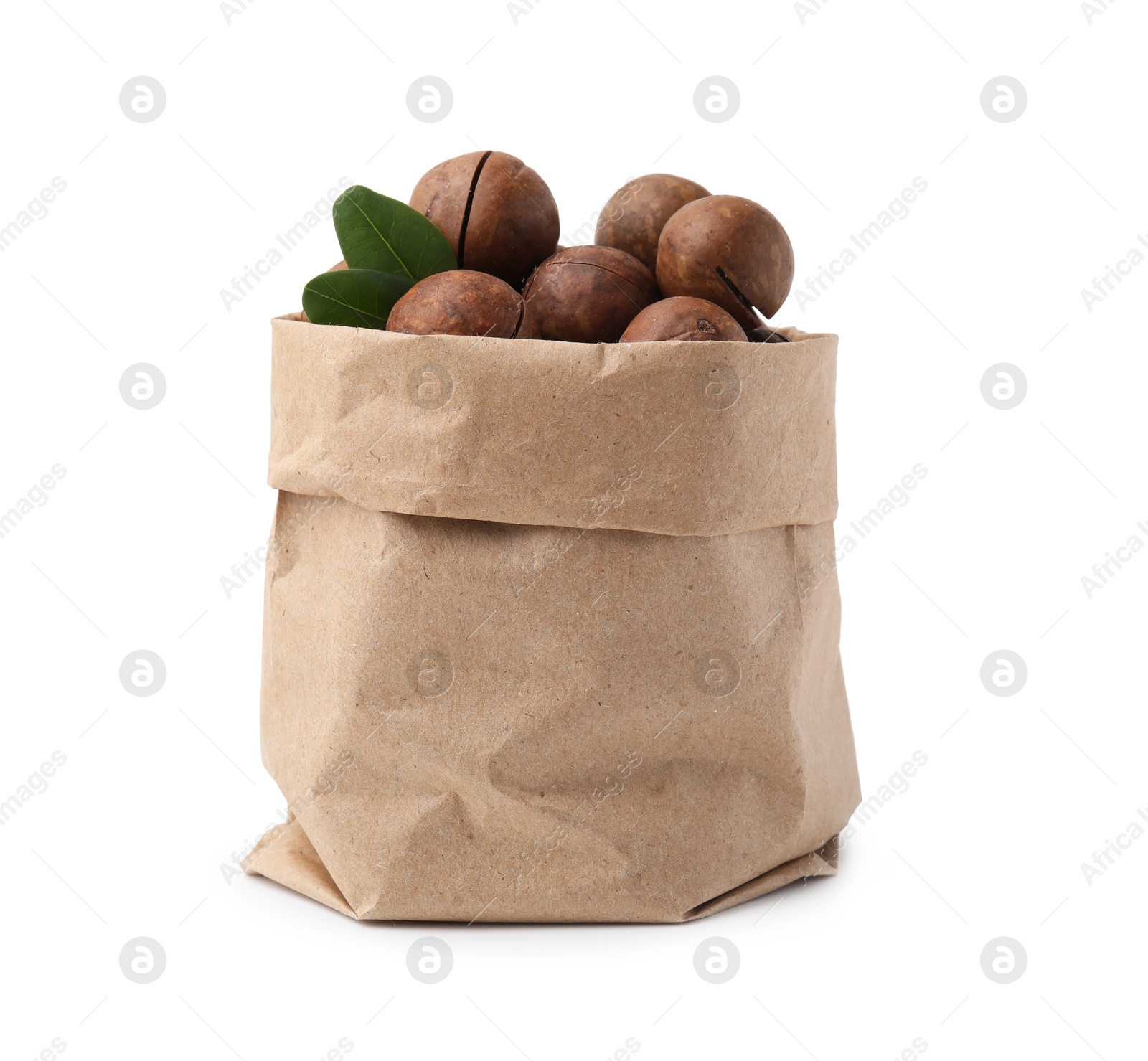 Photo of Macadamia nuts in paper bag isolated on white