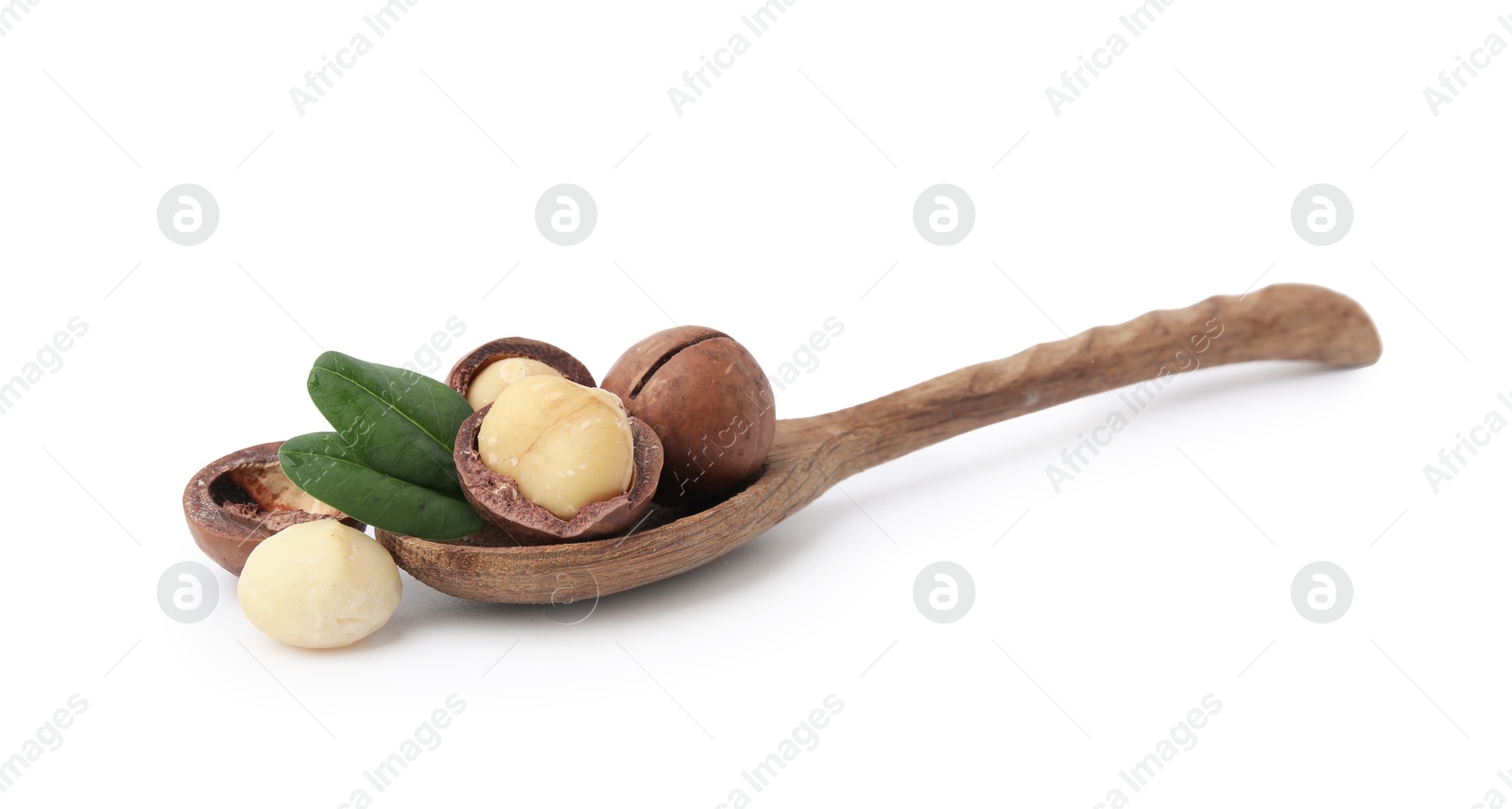 Photo of Spoon with macadamia nuts isolated on white