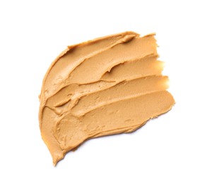 Photo of Tasty peanut butter on white background, top view