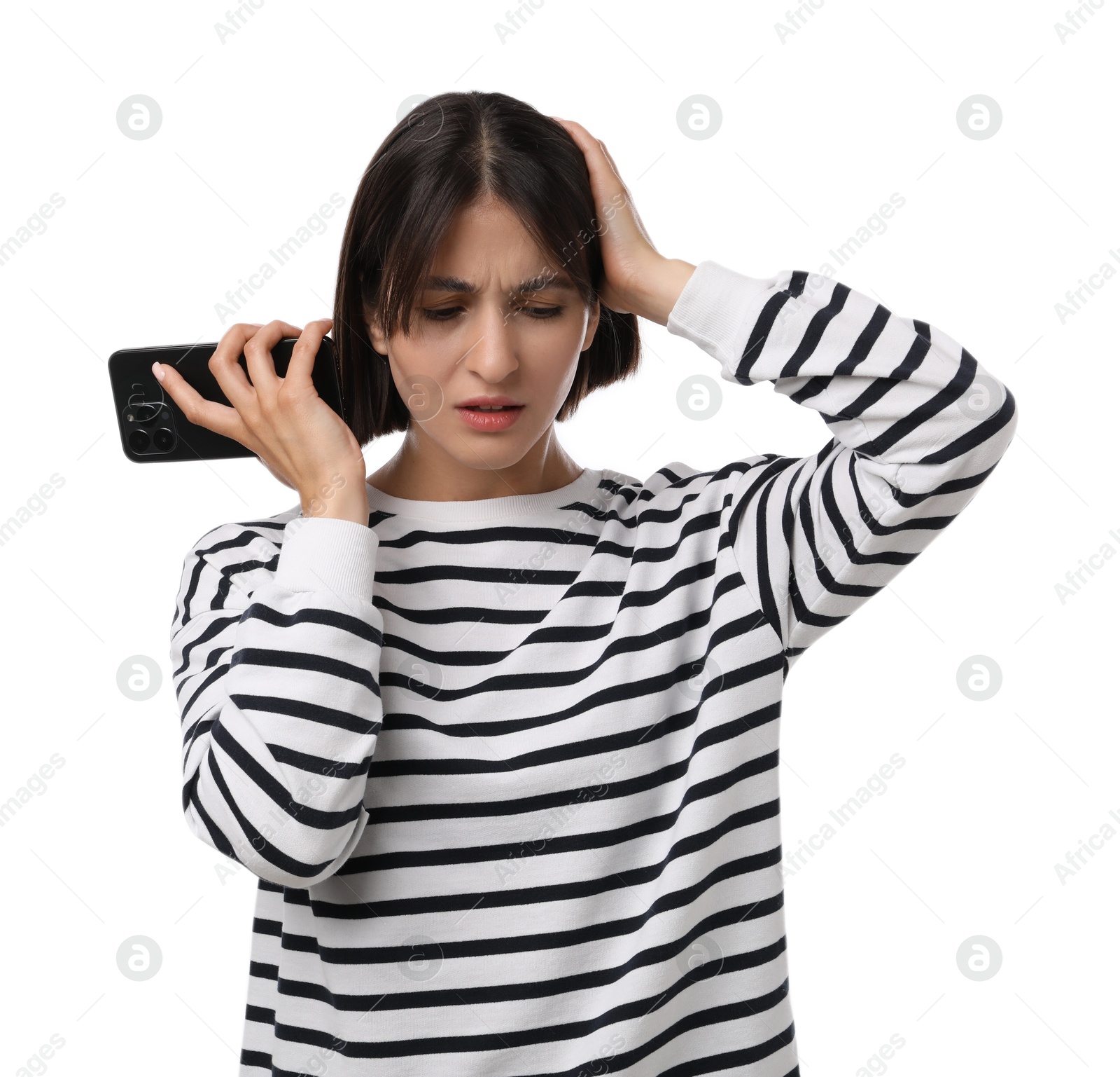 Photo of Unhappy woman with smartphone listening to voice message on white background