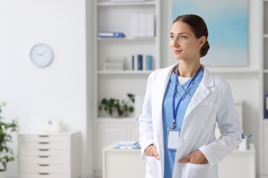 Portrait of nurse in medical uniform indoors, space for text