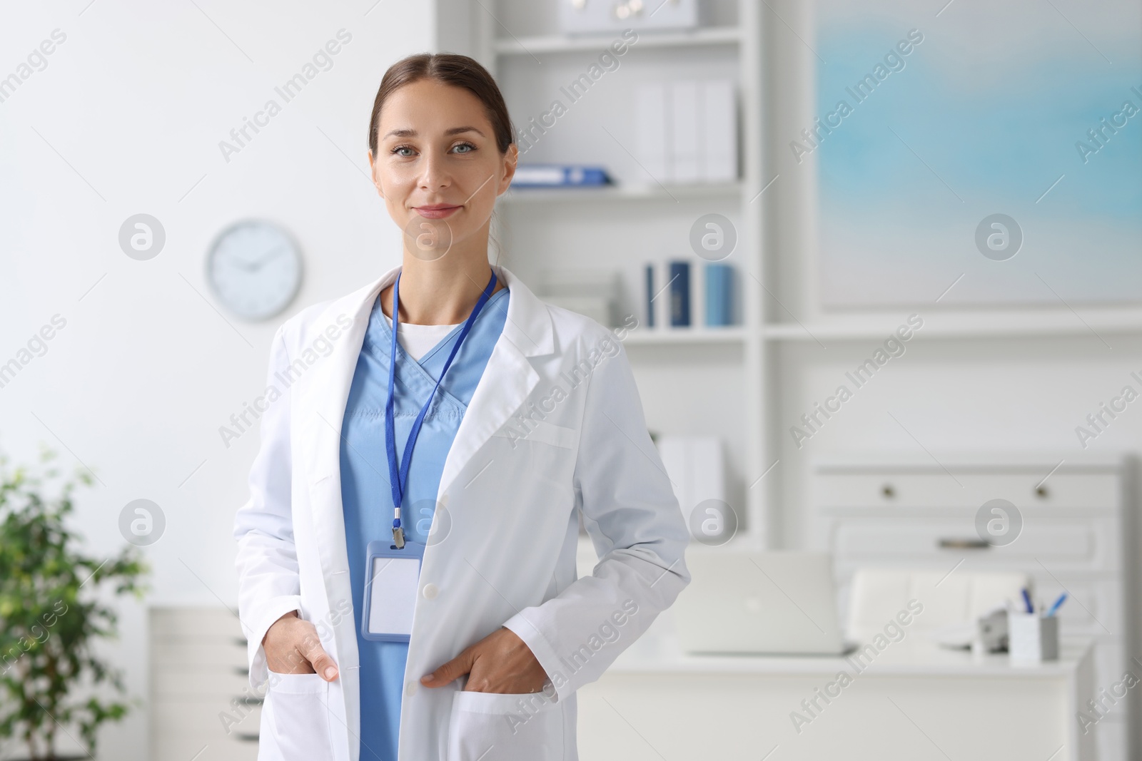 Photo of Portrait of nurse in medical uniform indoors, space for text