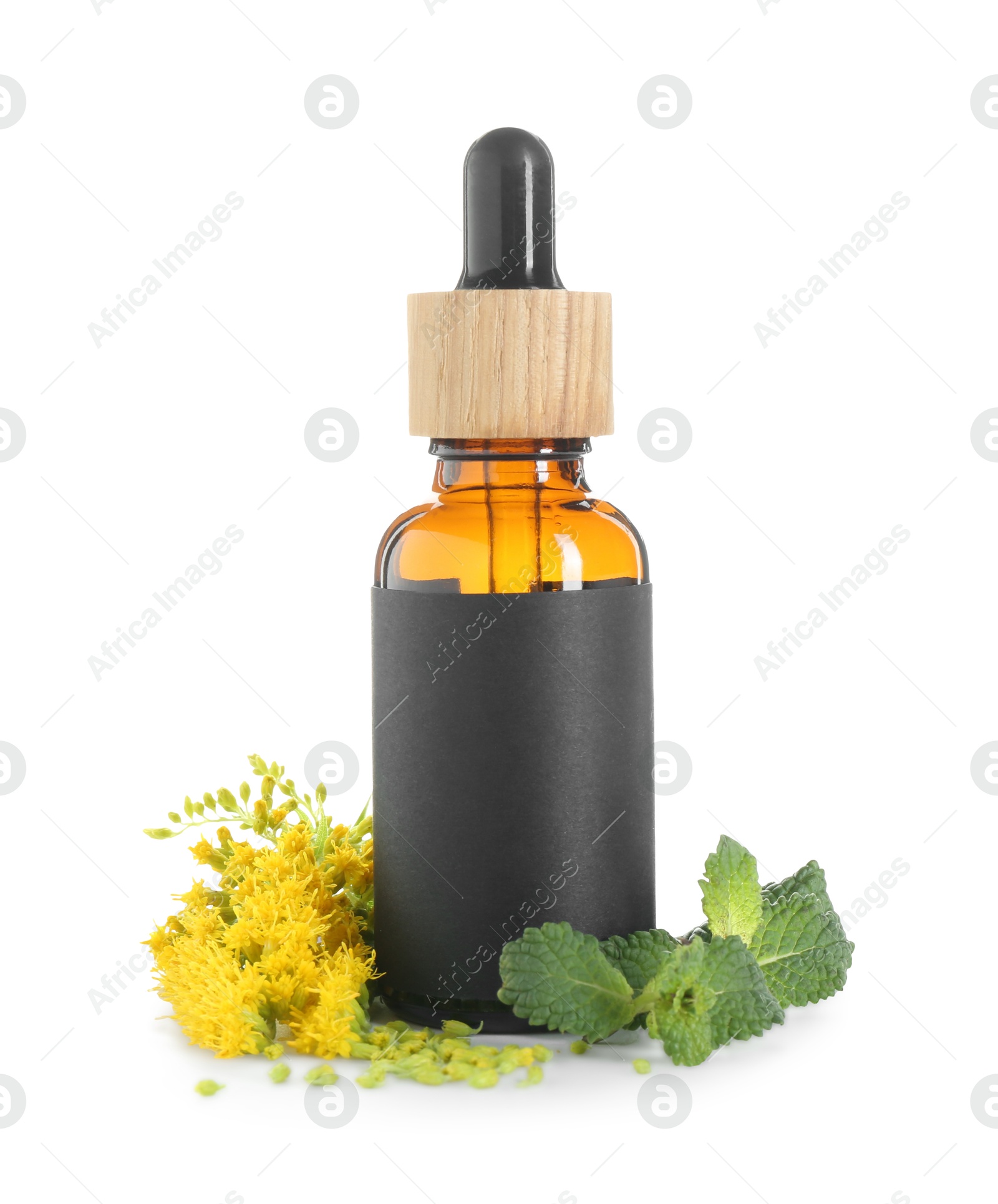 Photo of Bottle of tincture, mint and goldenrods flowers isolated on white