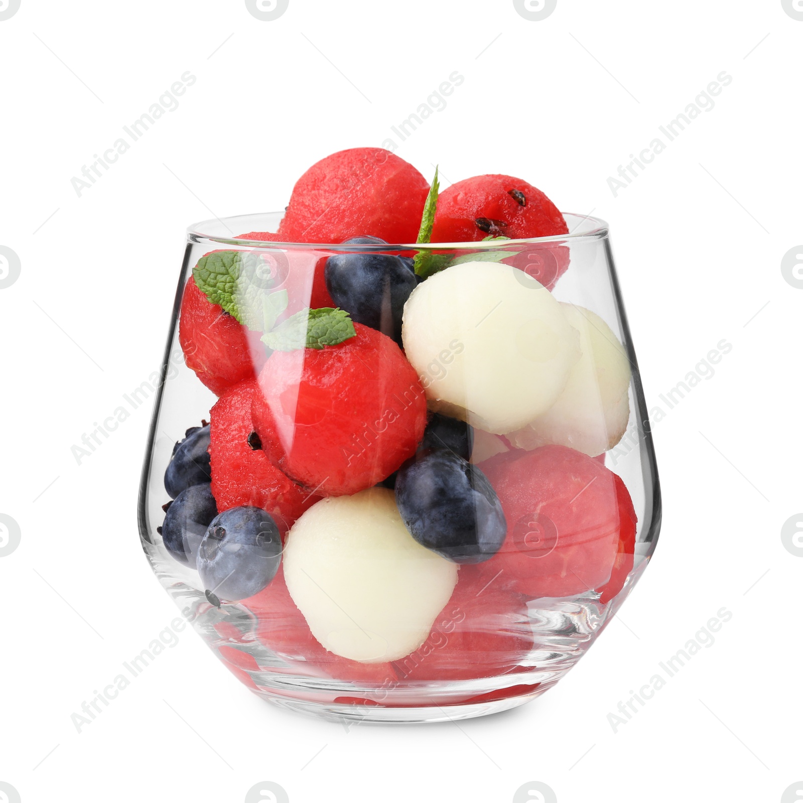 Photo of Tasty watermelon and melon balls with blueberries in glass isolated on white