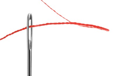 Photo of Sewing needle with red thread isolated on white, closeup