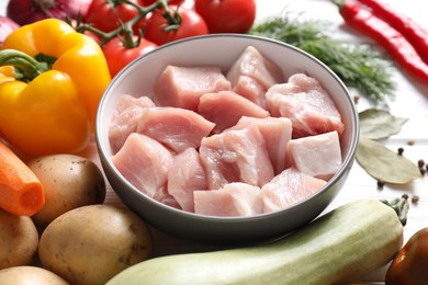 Photo of Uncooked ingredients for stew on white table, closeup