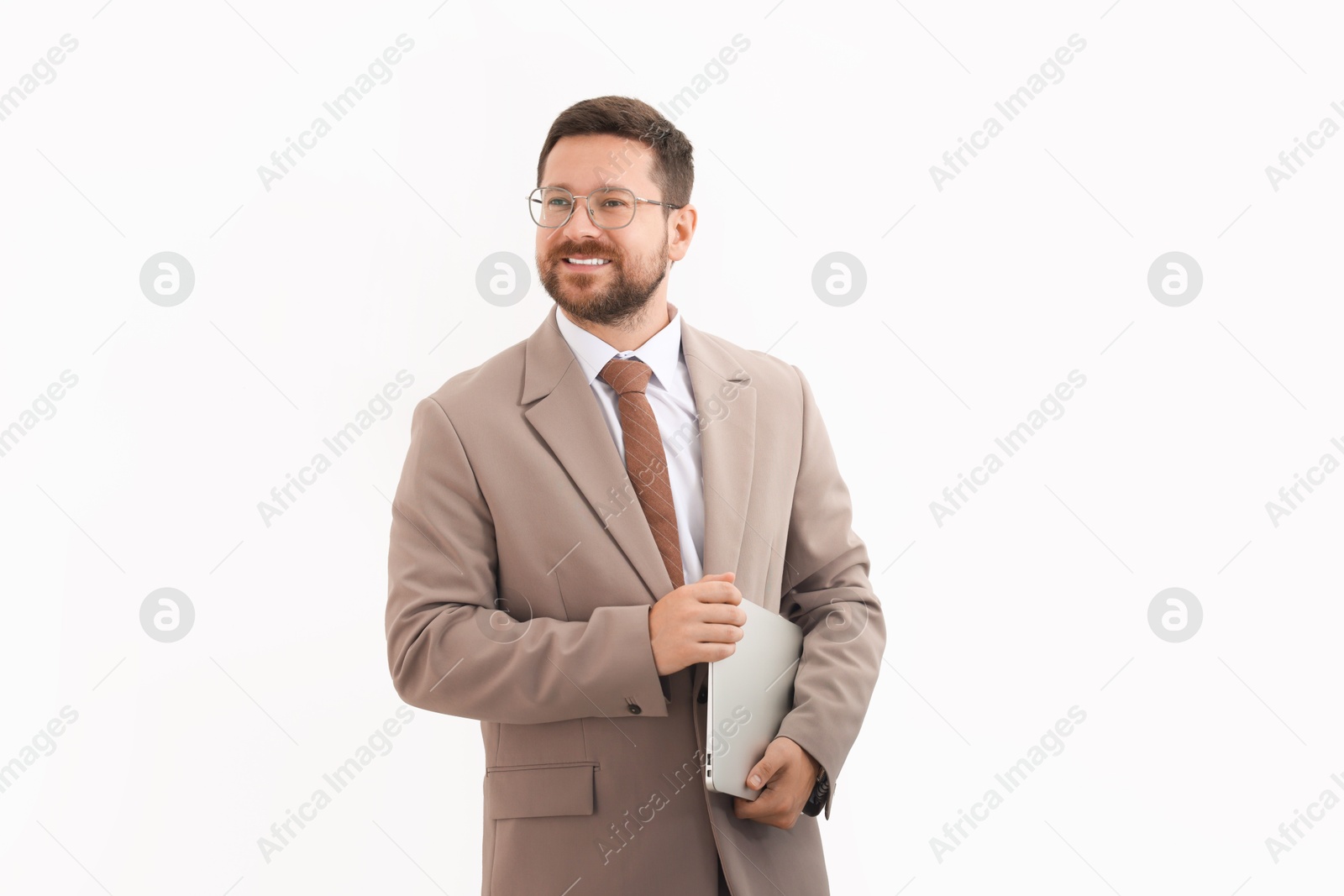 Photo of Portrait of smiling businessman with laptop on light background