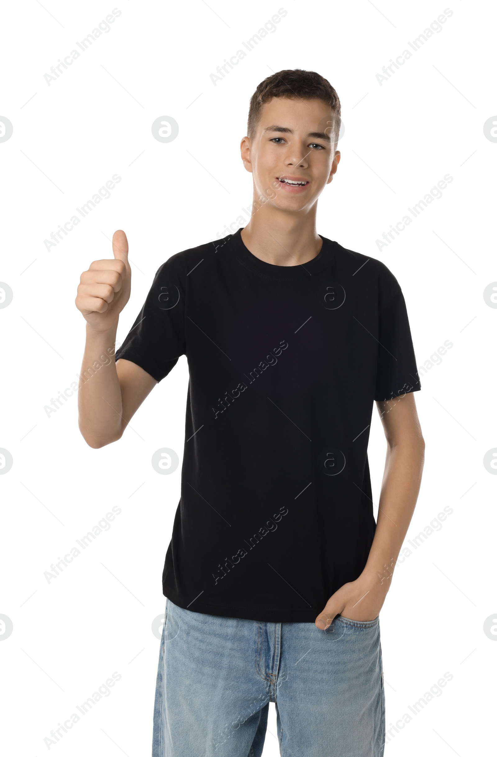 Photo of Teenage boy wearing black t-shirt and showing thumbs up on white background