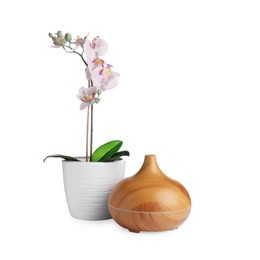 Photo of Aroma oil diffuser and orchid flower isolated on white