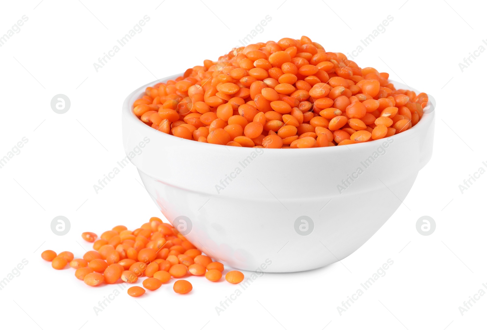 Photo of Raw lentils in bowl isolated on white