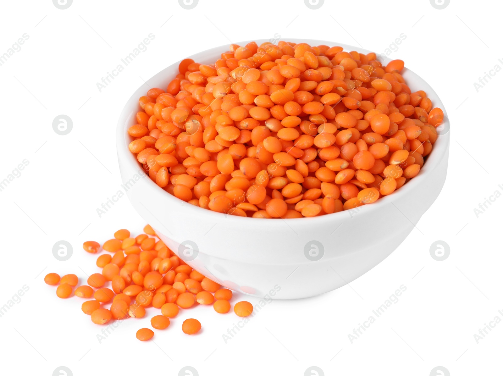 Photo of Raw lentils in bowl isolated on white