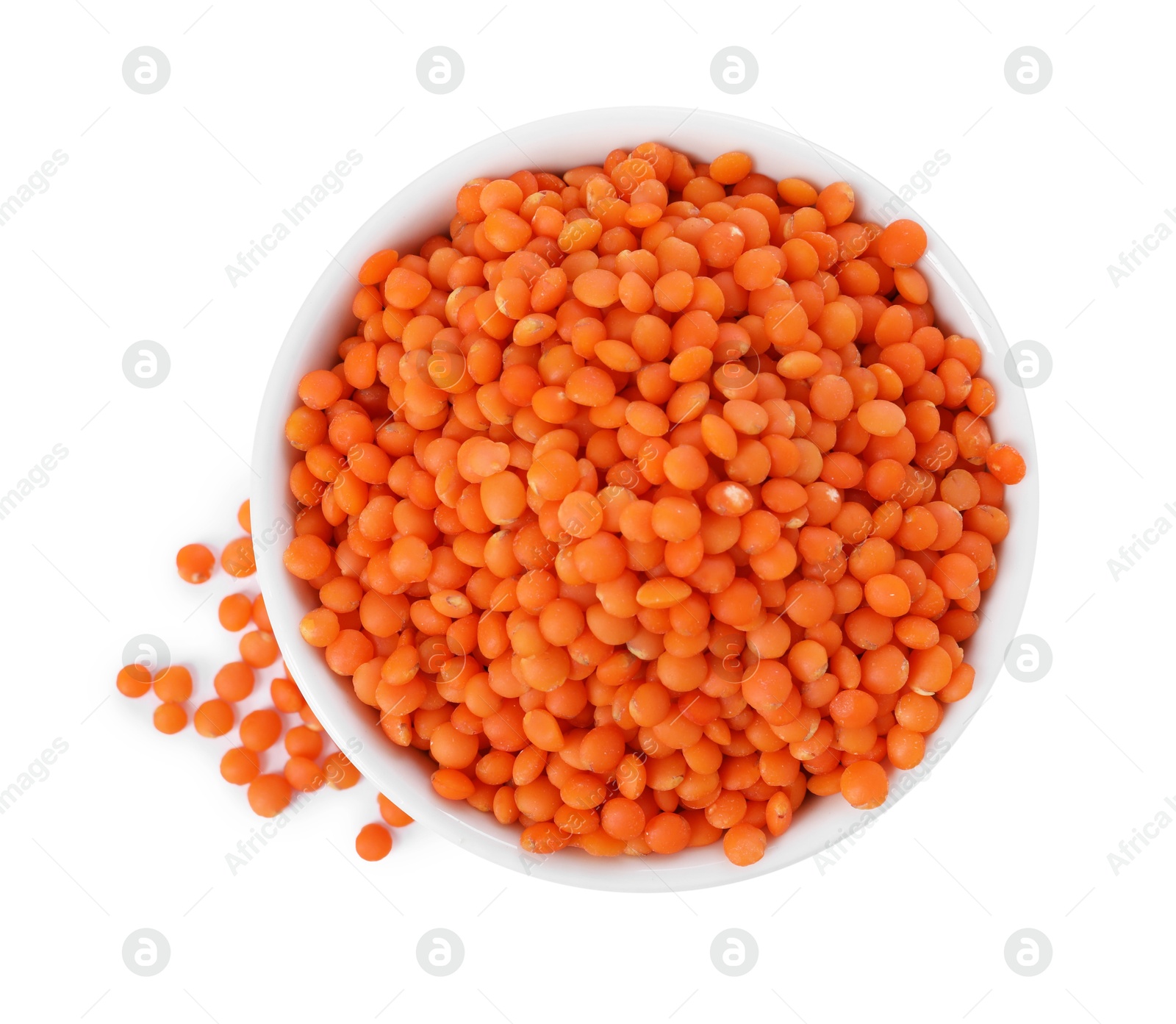 Photo of Raw lentils in bowl isolated on white, top view