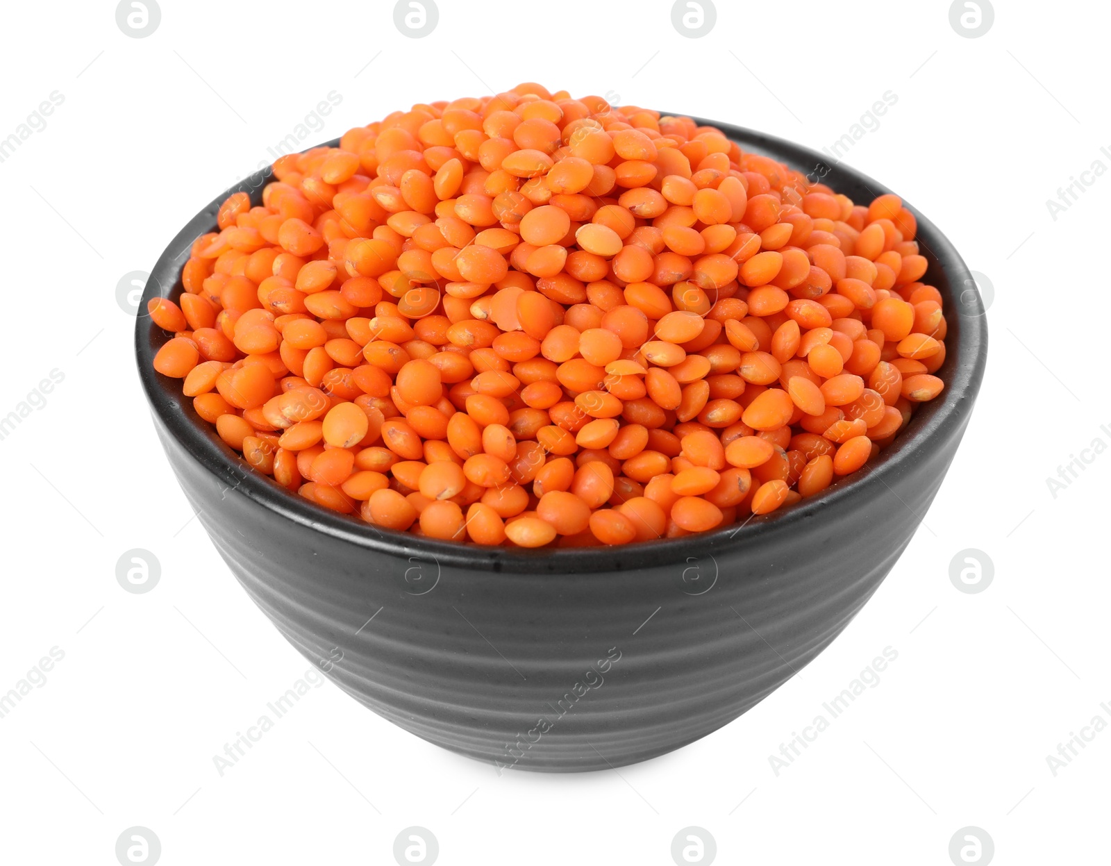 Photo of Raw lentils in bowl isolated on white