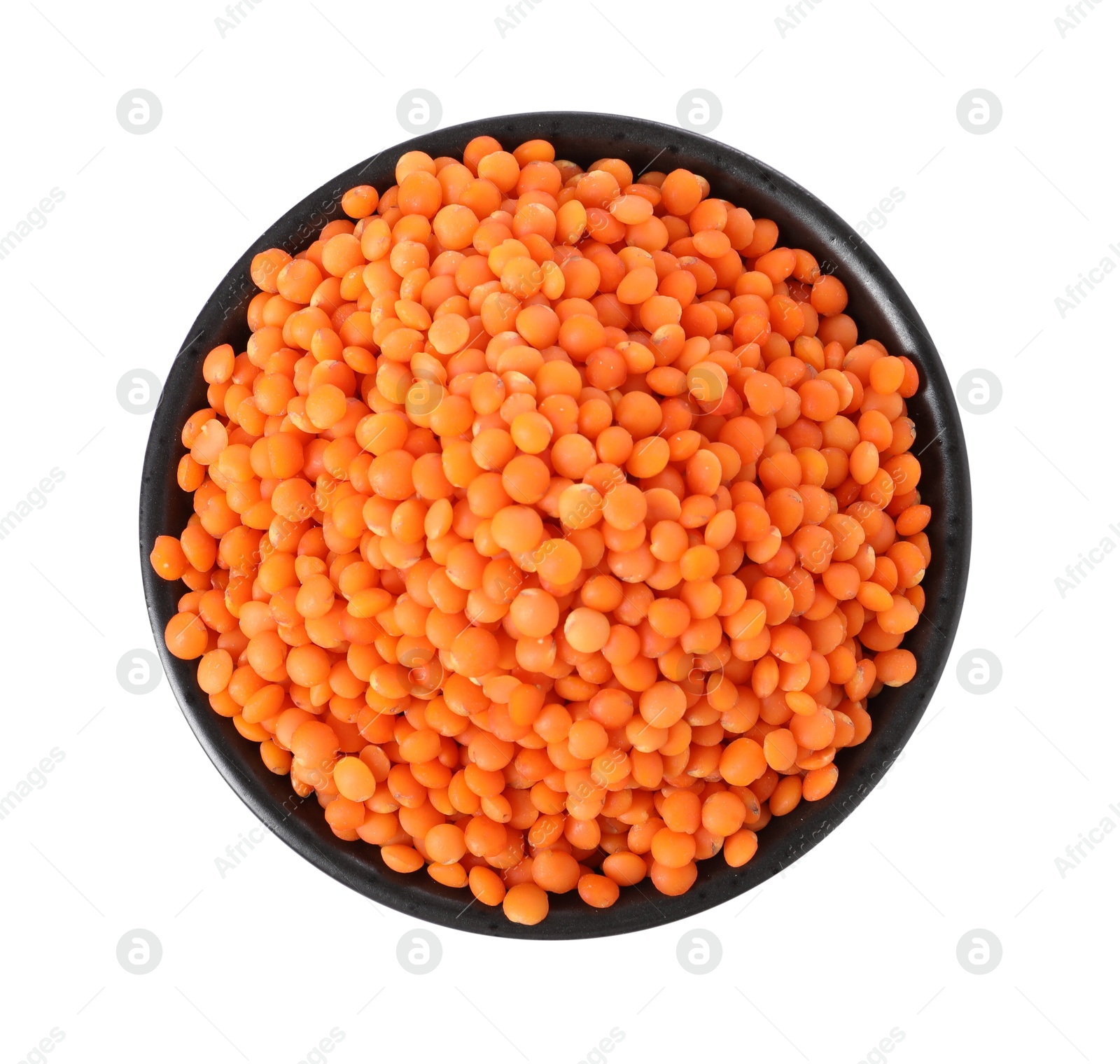 Photo of Raw lentils in bowl isolated on white, top view