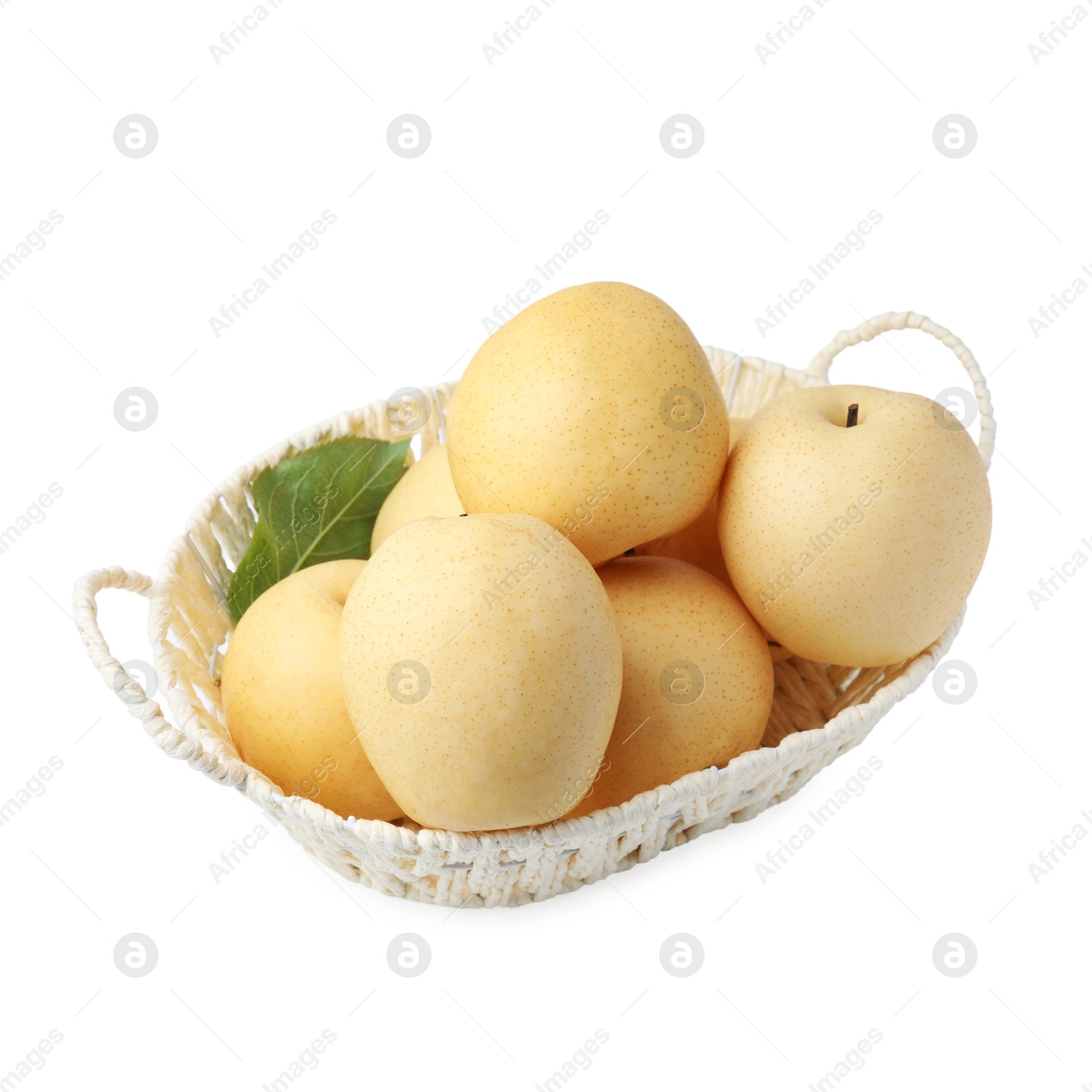 Photo of Delicious fresh apple pears in wicker basket isolated on white