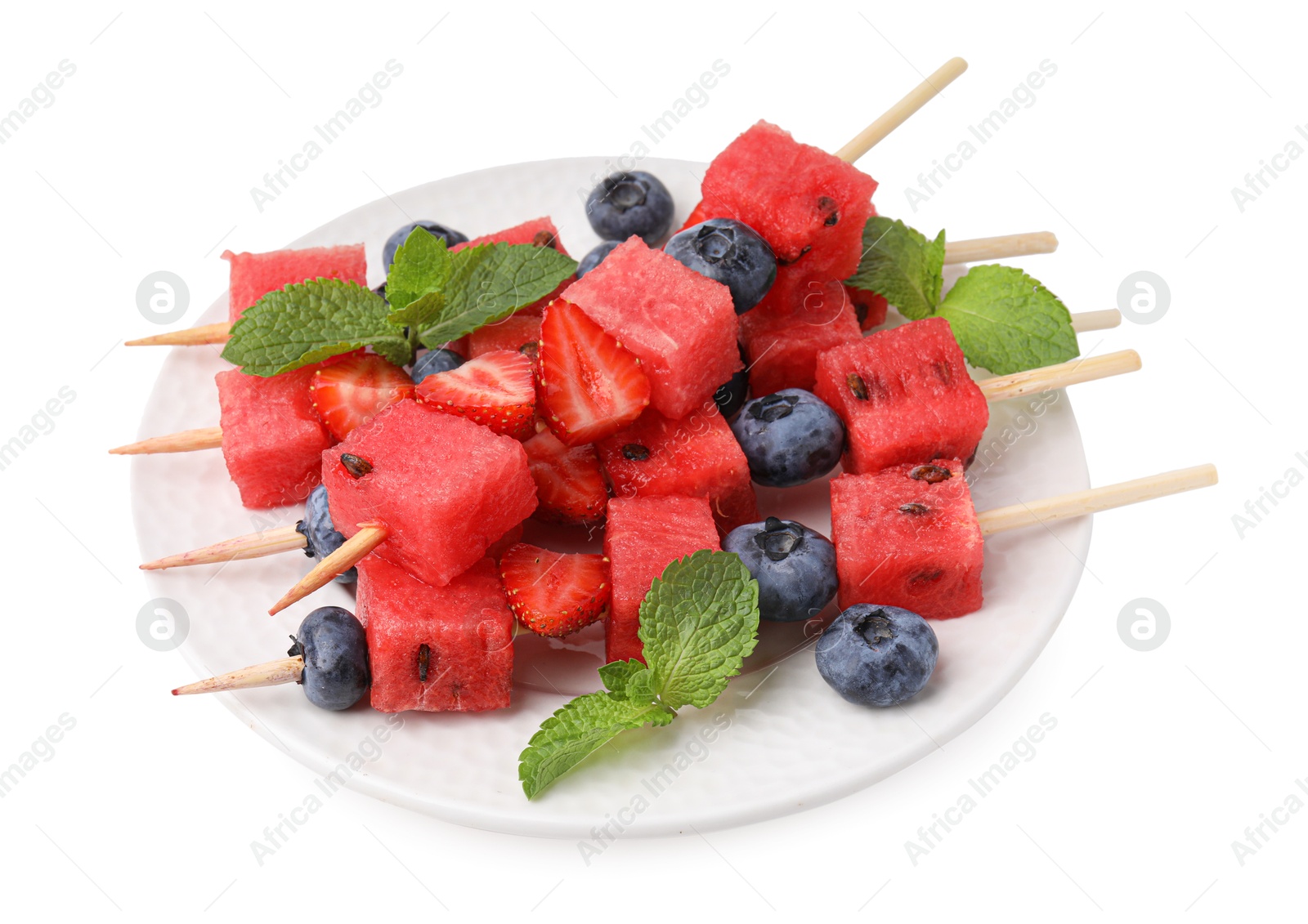 Photo of Skewers with tasty watermelon, strawberries, blueberries and mint isolated on white