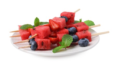 Photo of Skewers with tasty watermelon, strawberries, blueberries and mint isolated on white