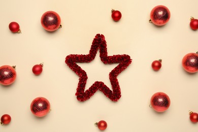 Photo of Flat lay composition with Christmas balls and decorative star on beige background