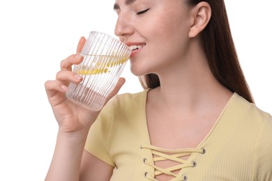 Photo of Woman drinking water with lemon on white background, closeup