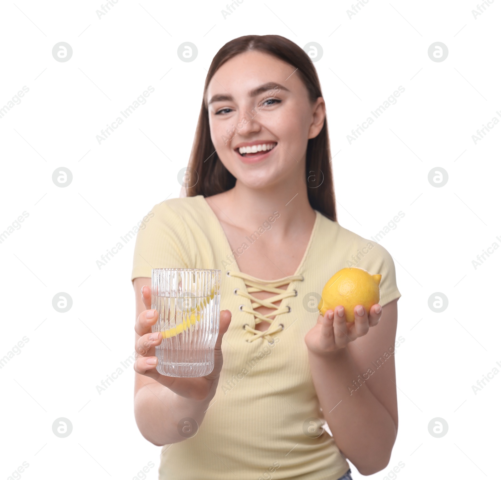 Photo of Woman with glass of lemon water and fruit on white background, selective focus