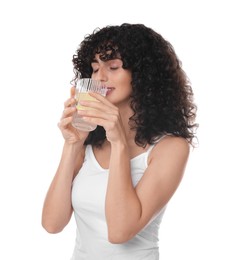 Photo of Woman drinking water with lemon on white background