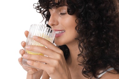 Woman drinking water with lemon on white background, closeup