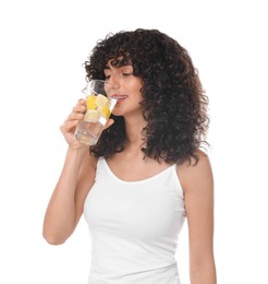 Photo of Woman drinking water with lemon on white background