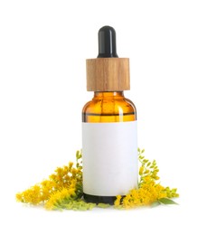 Photo of Bottle of tincture and goldenrods flowers isolated on white