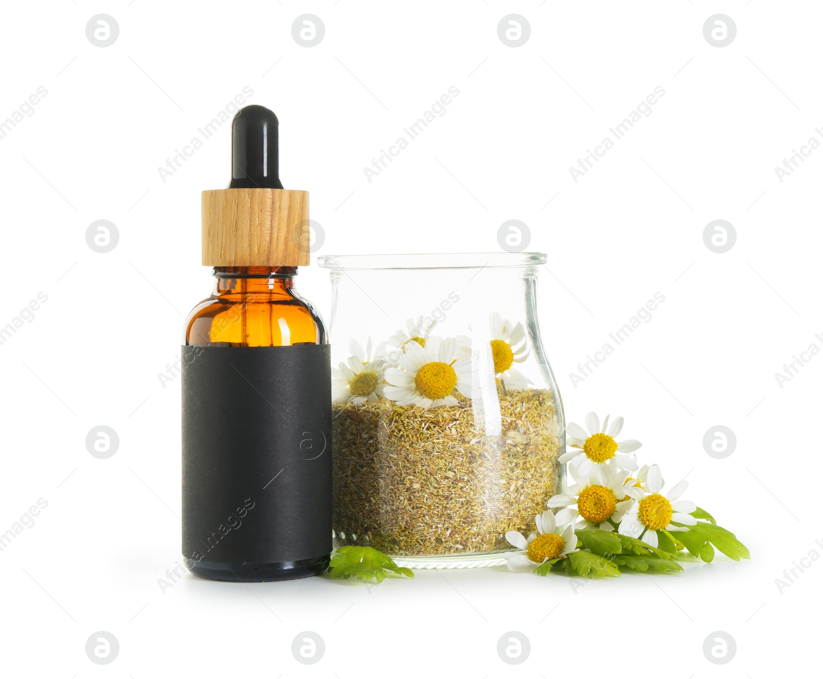 Photo of Bottle of tincture and daisy flowers isolated on white