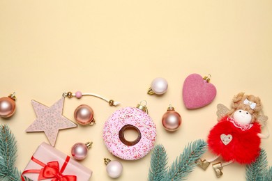 Photo of Flat lay composition with Christmas decor and gift box on beige background. Space for text