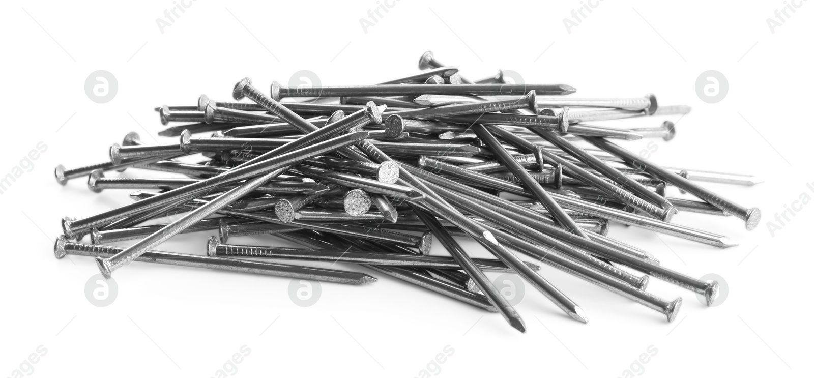 Photo of Pile of metal nails on white background