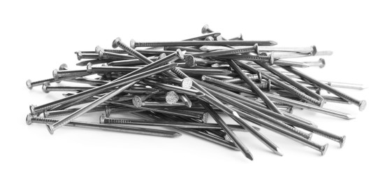 Photo of Pile of metal nails on white background