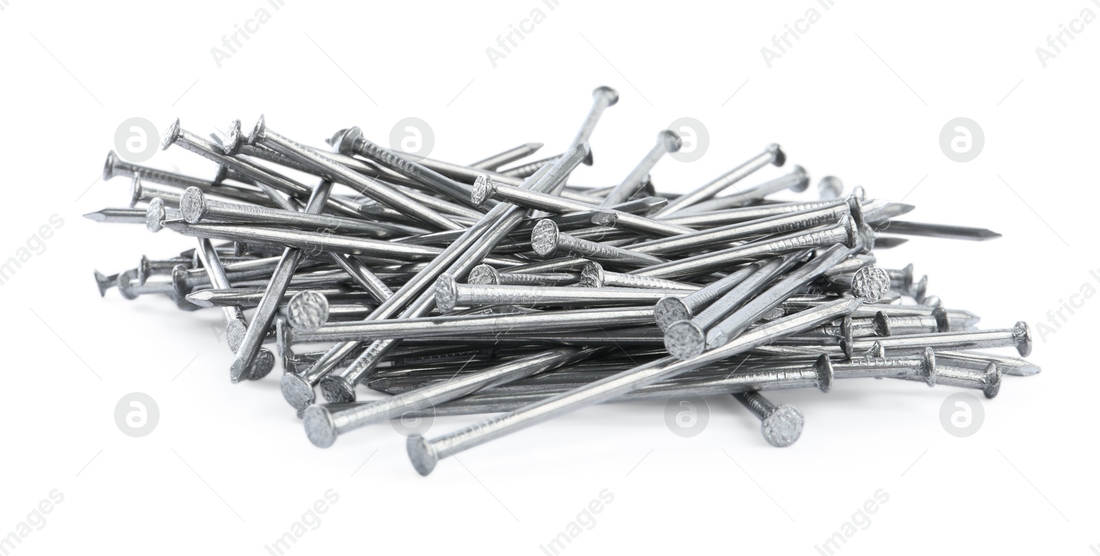 Photo of Pile of metal nails on white background