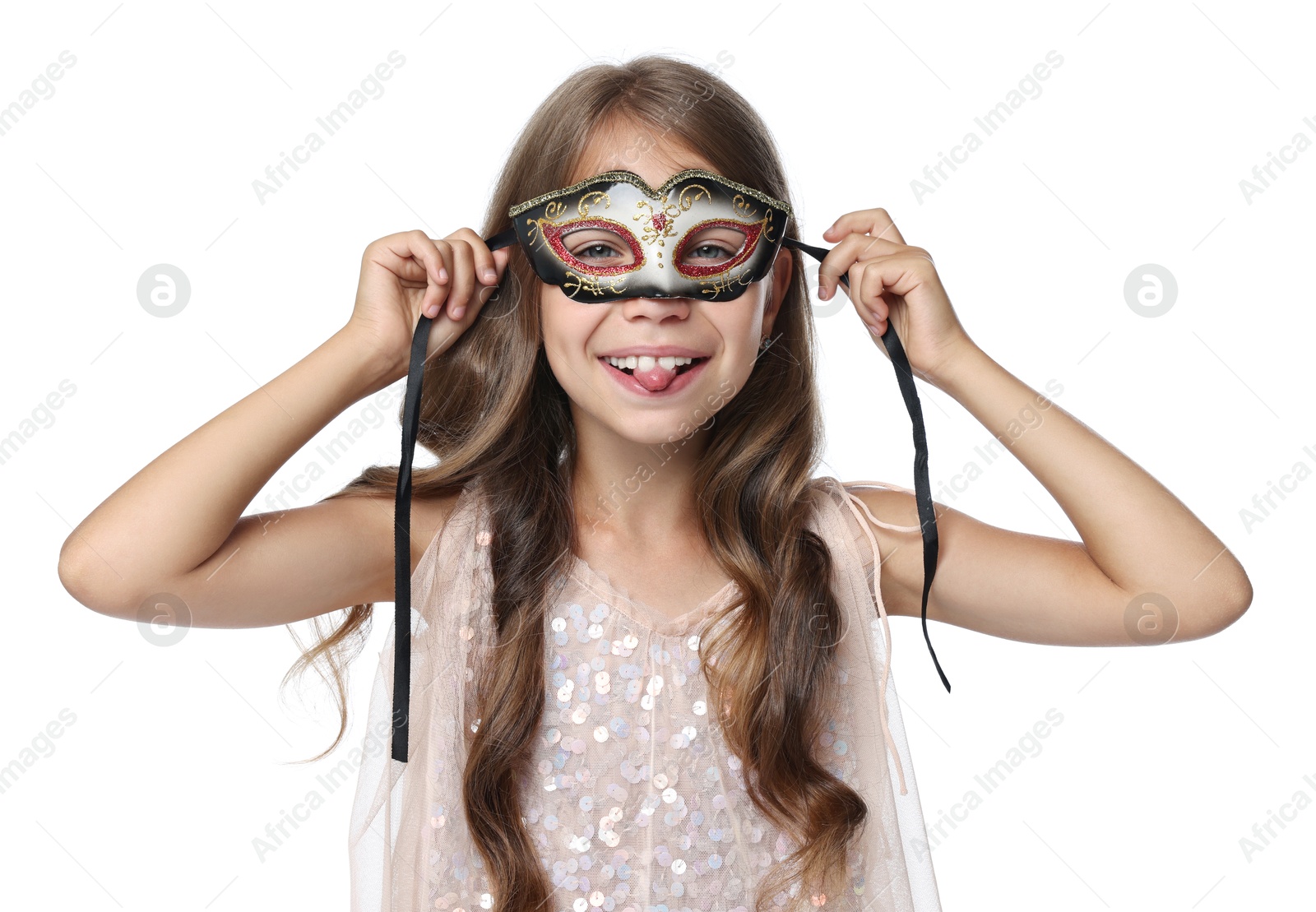 Photo of Cute girl wearing carnival mask and showing tongue on white background