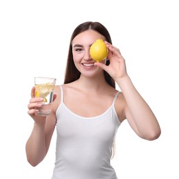 Woman with glass of lemon water and fruit on white background