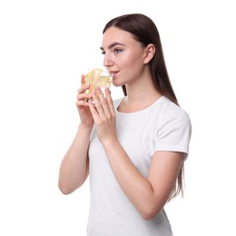 Woman drinking water with lemon on white background