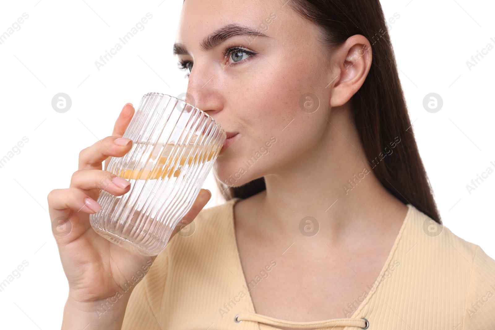 Photo of Woman drinking water with lemon on white background, closeup