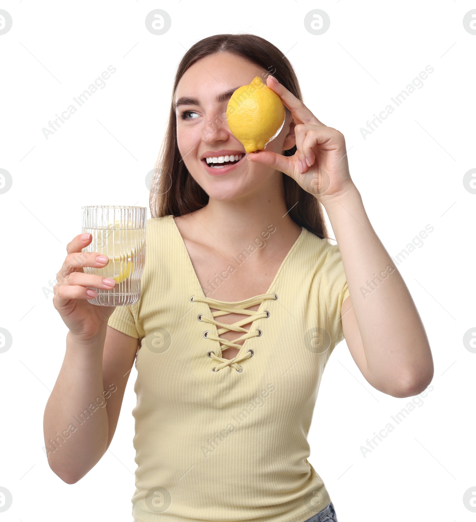 Photo of Woman with glass of lemon water and fruit on white background