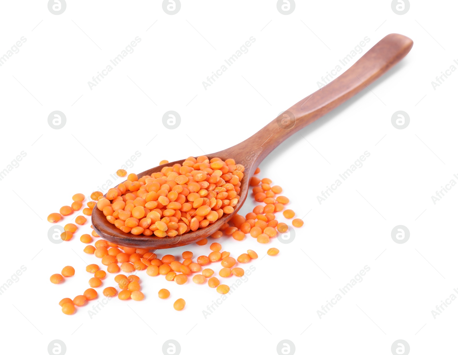 Photo of Raw lentils in spoon isolated on white