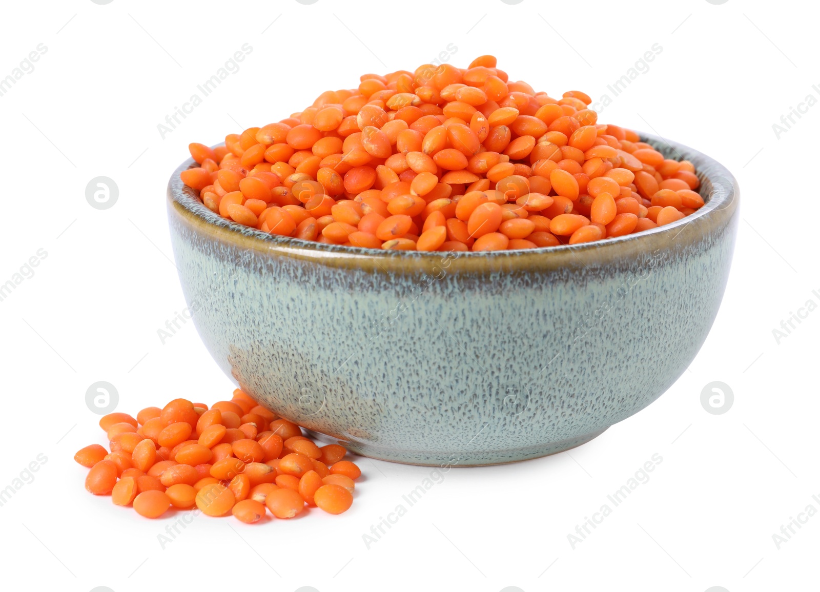 Photo of Raw lentils in bowl isolated on white